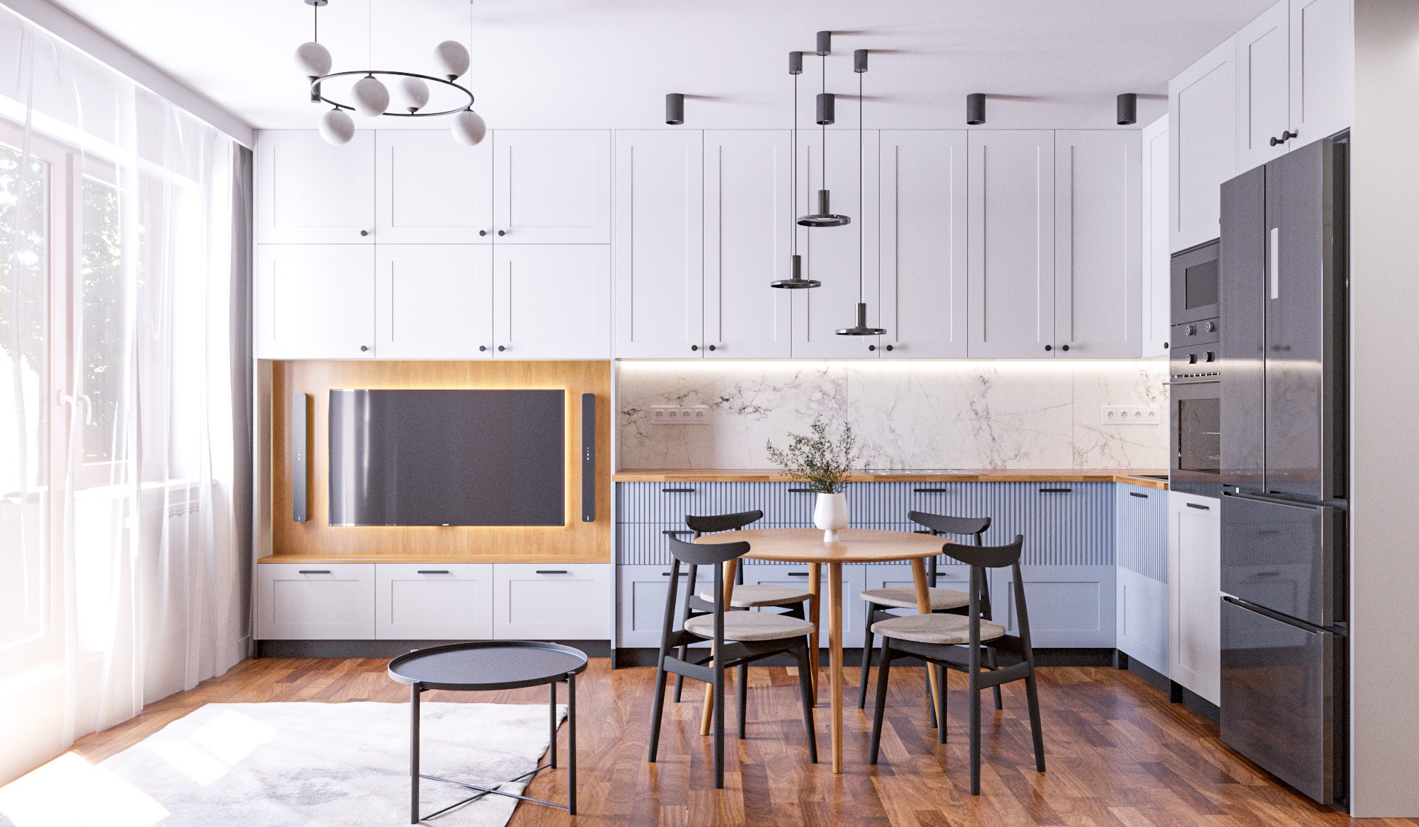 Nowoczesna kuchnia z elementami drewna: białe szafki, marmurowy backsplash, okrągły stół z czarnymi krzesłami i telewizor wbudowany w zabudowę. Jasne wnętrze z naturalnym światłem.