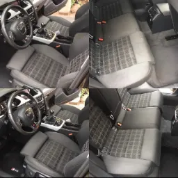 Wnętrze samochodu Audi A4 przed i po czyszczeniu tapicerki, widoczne różnice w czystości foteli i kanapy z charakterystycznym wzorem w kratę.