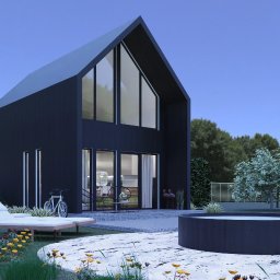 ekojama.pl - Wizualizacja nowoczesnego, czarnego domu z wysokim dachem, dużymi oknami, tarasem z leżakiem i okrągłym basenem na zewnątrz, rower oparty o ścianę.