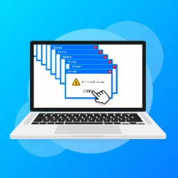 Laptop wyświetlający serię okien dialogowych z komunikatem o błędzie krytycznym, na ekranie widoczny kursor myszy wskazujący na przycisk OK.