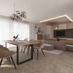 Jasne, przestronne wnętrze salonu z jadalnią, beżowa sofa modułowa, stół z nakryciem i krzesłami, nowoczesny żyrandol i telewizor na ścianie z marmurowym panelem.