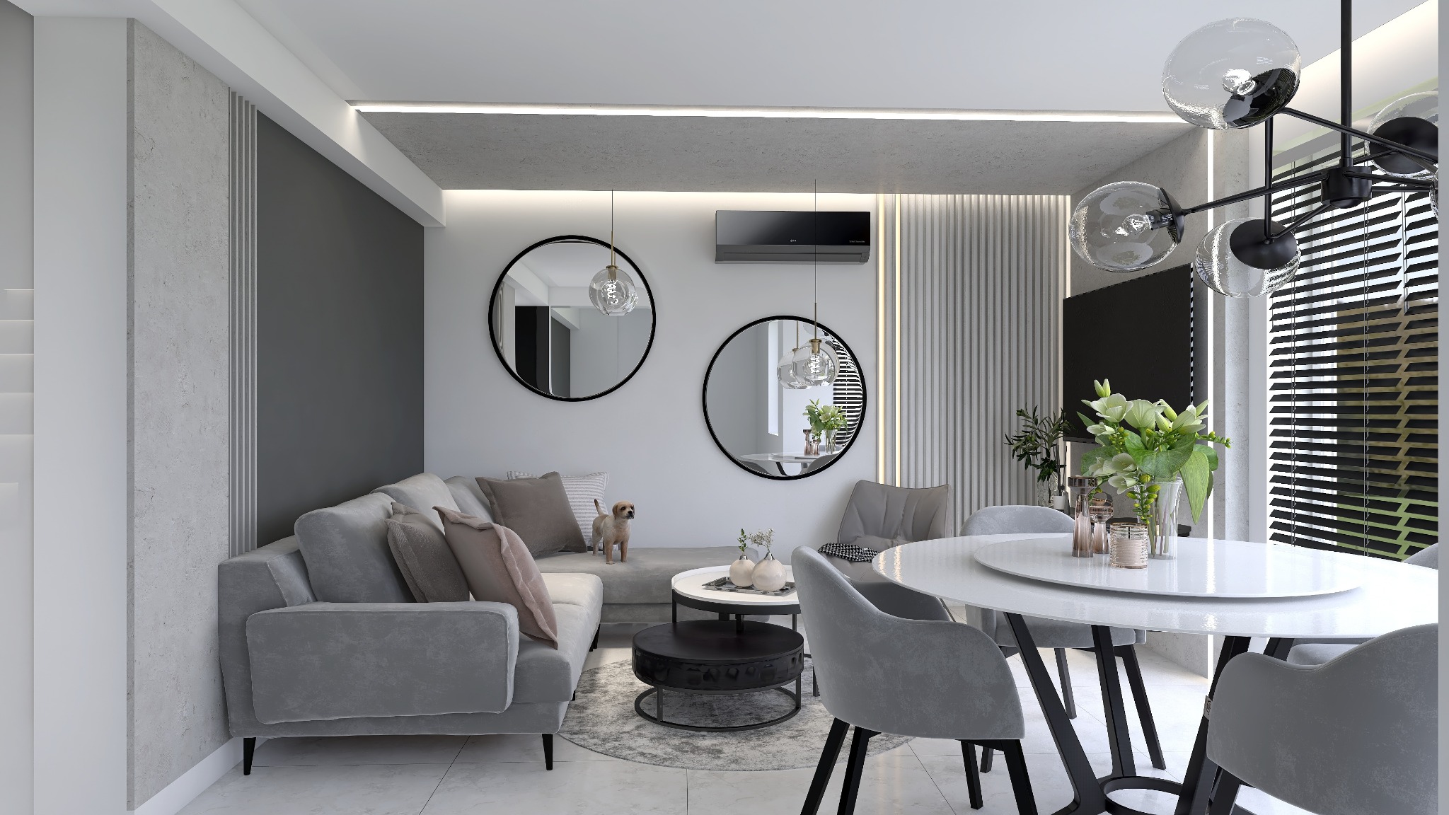 Nowoczesne wnętrze salonu z jadalnią w szarościach, z okrągłym stołem, szklanymi lampami i lustrami, oraz małym psem stojącym na sofie.