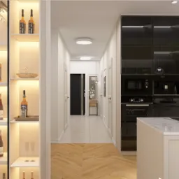 Nowoczesna kuchnia z wyspą, zabudową w kolorach beżu i czerni, oraz przeszkloną szafką na alkohole z podświetleniem LED.