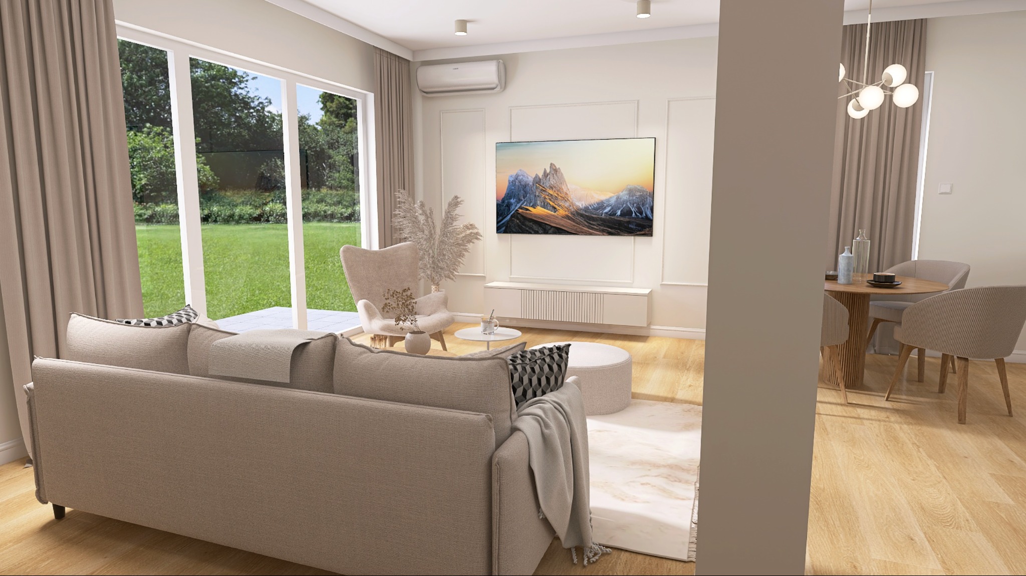 Jasne wnętrze salonu z beżową sofą, fotel uszak, okrągły stolik i telewizor na ścianie. Widok na jadalnię z okrągłym stołem i krzesłami. Duże okno z widokiem na zieleń.