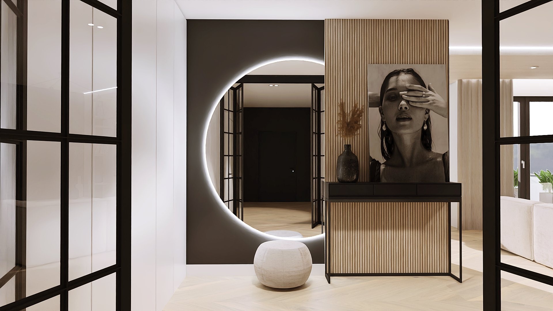 Nowoczesny przedpokój w Brzeźnicy z okrągłym lustrem podświetlanym LED, konsolą z drewnianymi lamelami, pufą i czarno-białym portretem kobiety.