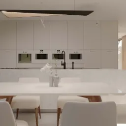 Jasna, minimalistyczna kuchnia z wyspą i białym stołem jadalnym, widok na ogród przez duże okno, nowoczesne oświetlenie.