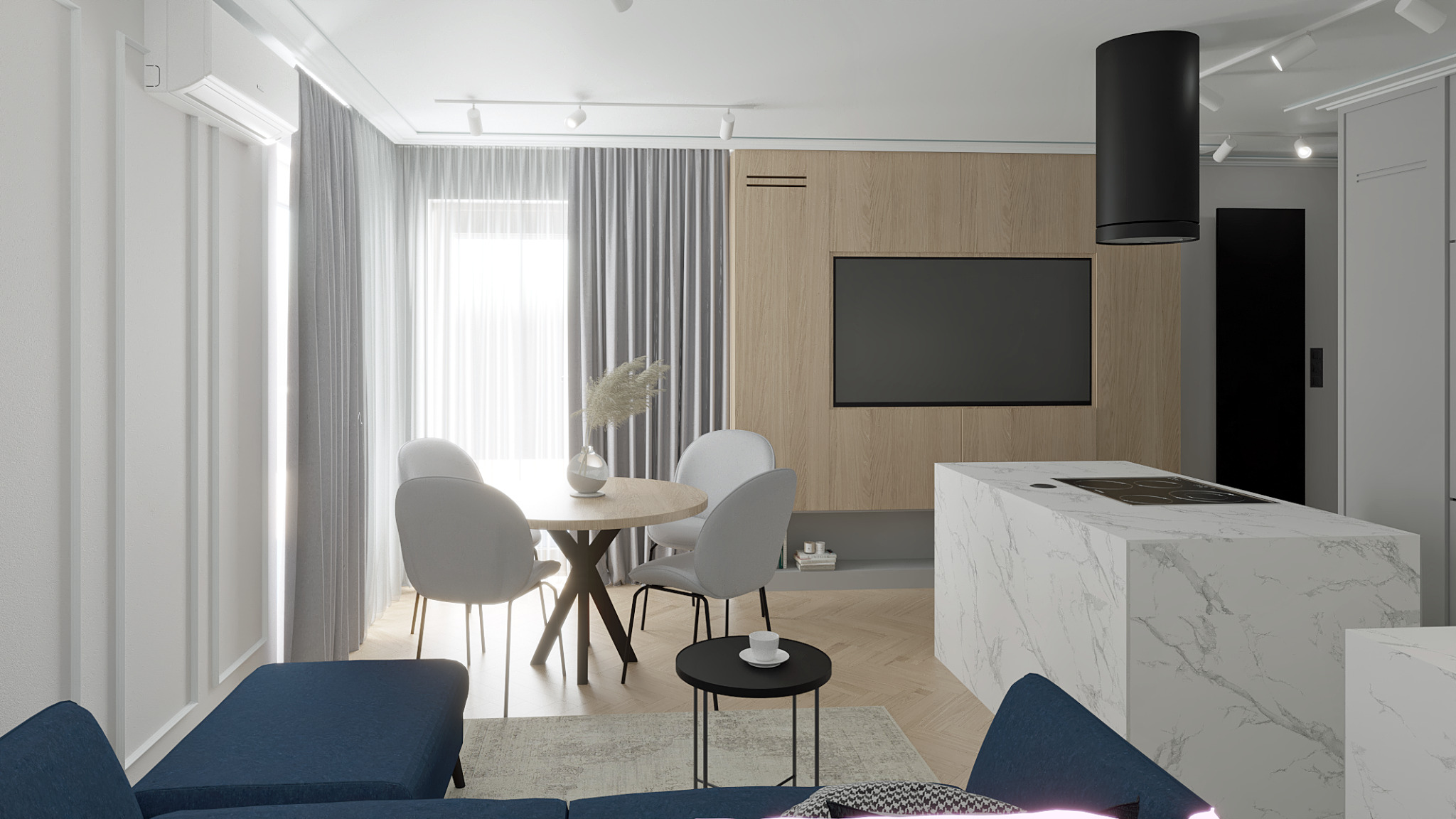 Jasne wnętrze mieszkania z okrągłym stołem jadalnym, białymi krzesłami, marmurowym blatem kuchennym i drewnianą ścianą z telewizorem.