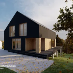 Wizualizacja nowoczesnego domu z czarną elewacją i drewnianymi akcentami, otoczonego jesiennym krajobrazem. Widoczne detale architektoniczne i gra światła.