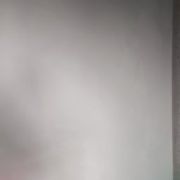 PERFEKTYNKI Patryk Jarząbski - Świeżo pomalowana, gładka ściana w odcieniach szarości, z delikatnym gradientem światła.