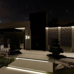 BIURO PROJEKTOWE Sylwia Sikora - Nowoczesna elewacja domu z numerem 24 podświetlonym nocą, ozdobne panele ażurowe, kamienna aranżacja ogrodu z podświetlonymi ścieżkami.