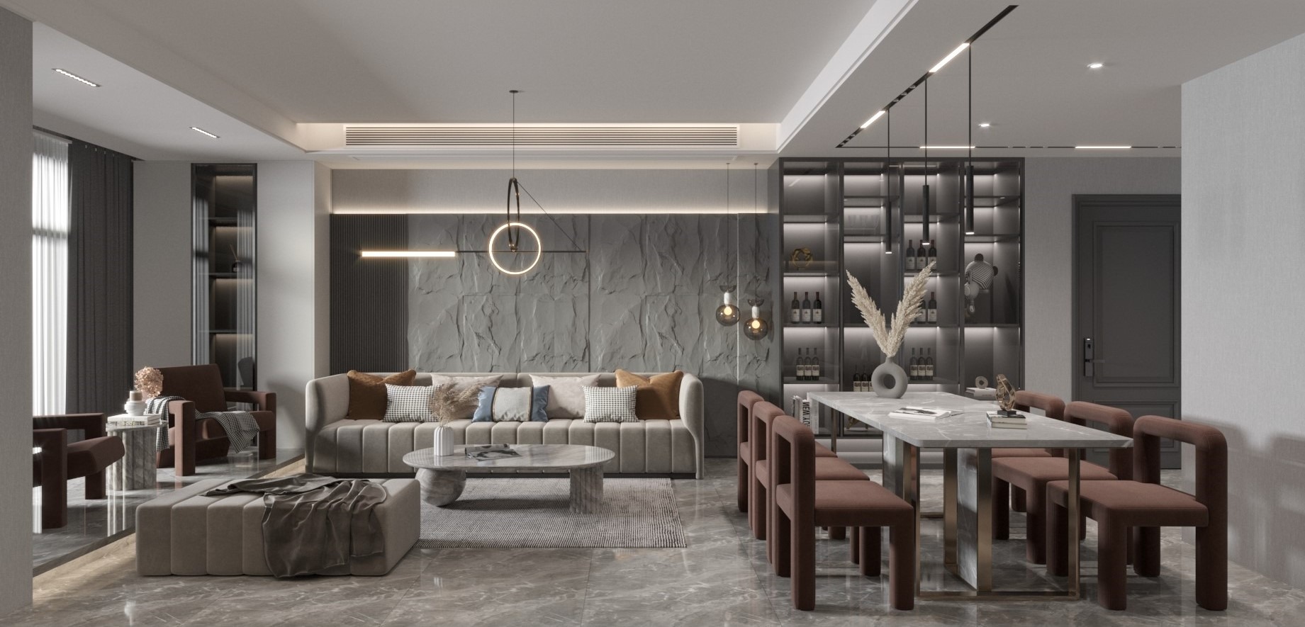 Nowoczesne wnętrze salonu z jadalnią, szara sofa z poduszkami, marmurowy stolik kawowy i stół z krzesłami w odcieniach brązu, na ścianie dekoracyjna okładzina imitująca kamień, oświetlenie punktowe...