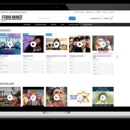 TRUST DEAL - Responsywna strona internetowa studia muzycznego na laptopie i smartfonie. Widoczne sekcje 'Nowości' i 'Bestsellery' z okładkami albumów i opcjami odtwarzania.