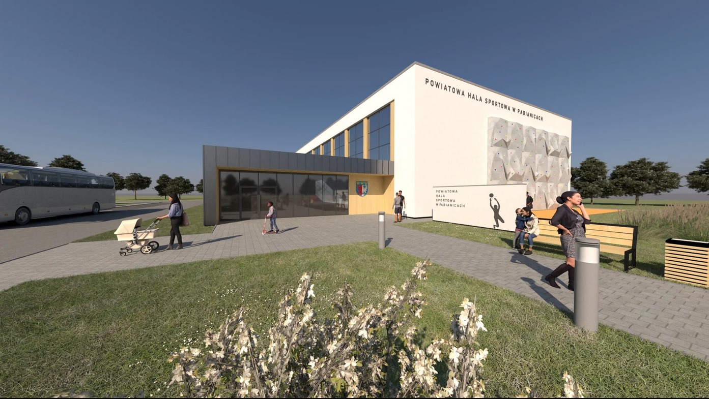 Wizualizacja hali sportowej z zewnętrzną ścianą do wspinaczki, placem zabaw i autobusem w tle, Pabianice.