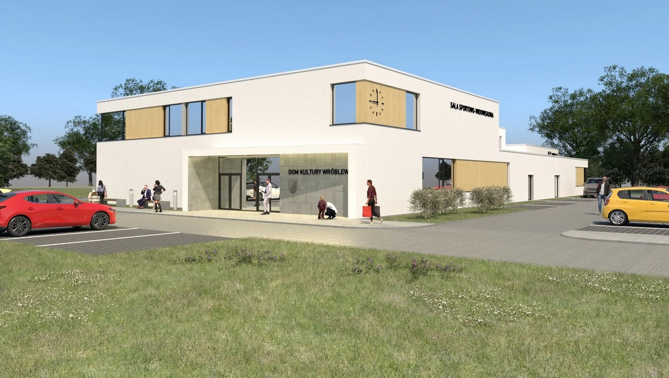 Wizualizacja budynku Domu Kultury z salą sportową, z parkingiem i zielonym terenem, widoczne osoby w otoczeniu.