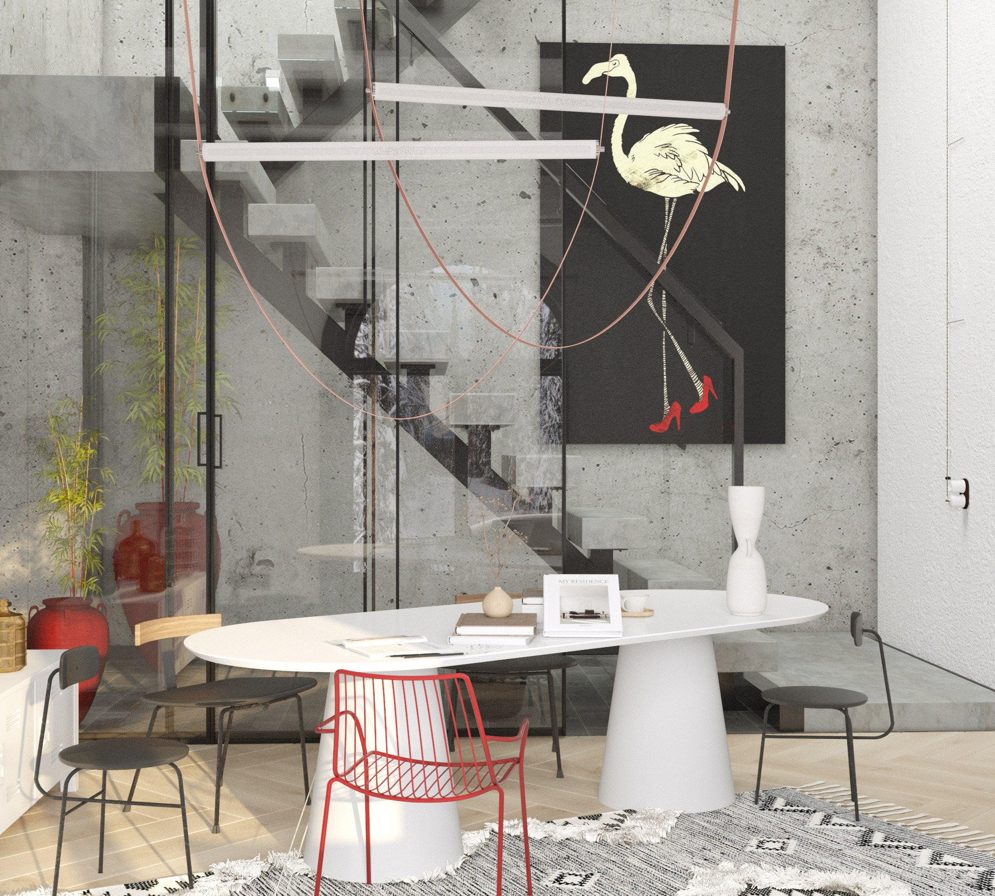 Nowoczesne wnętrze z betonowymi ścianami, szklanymi schodami i okrągłym białym stołem otoczonym krzesłami, w tym jednym czerwonym metalowym krzesłem. Na ścianie wisi czarno-biały obraz...