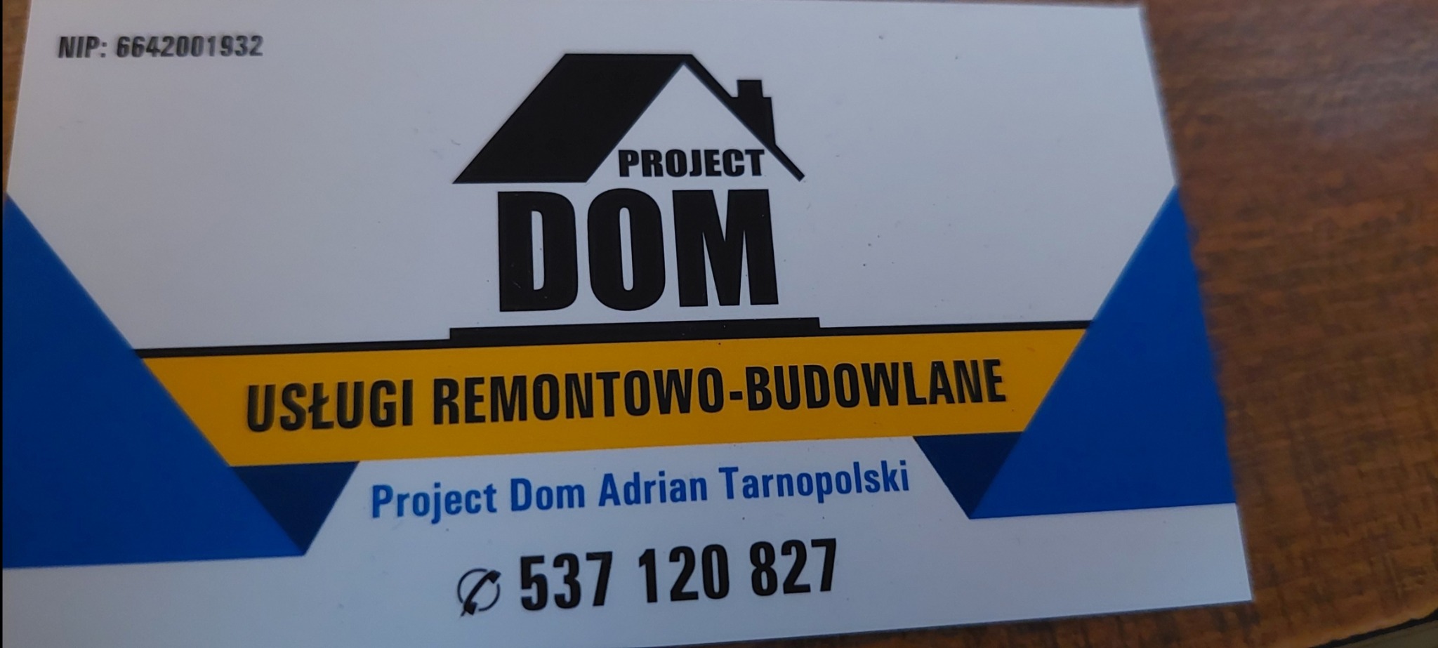 Wizytówka firmy Project Dom Adrian Tarnopolski oferującej usługi remontowo-budowlane, z numerem telefonu i NIP.