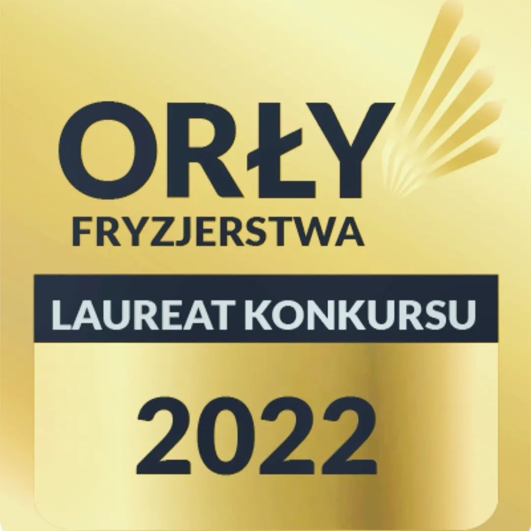 Złota naklejka z napisem 'Orły Fryzjerstwa', informacją o byciu laureatem konkursu w roku 2022 i graficznym symbolem przypominającym promienie światła.