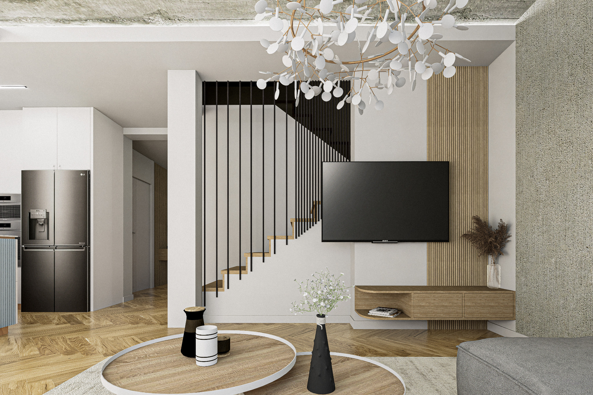 Nowoczesny salon z drewnianą podłogą, schodami z czarną balustradą i telewizorem. Uwagę zwraca designerski żyrandol i okrągły stolik kawowy.