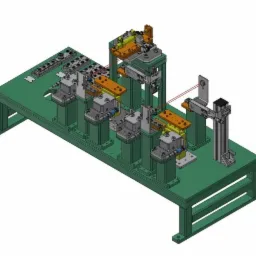 Model 3D stanowiska montażowego z elementami pneumatycznymi i laserowym wskaźnikiem, prezentowany w rzucie izometrycznym.