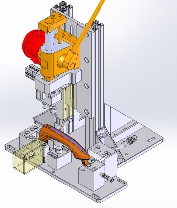 Model 3D stanowiska testowego z uchwytem samochodowym, widok z góry. Elementy w kolorach: srebrny, pomarańczowy, czerwony. Projekt CAD/CAM/CAE.