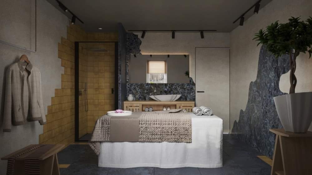 Wnętrze gabinetu spa z łóżkiem do masażu, umywalką w lustrze i dekoracyjną ścianą z motywem górskim.