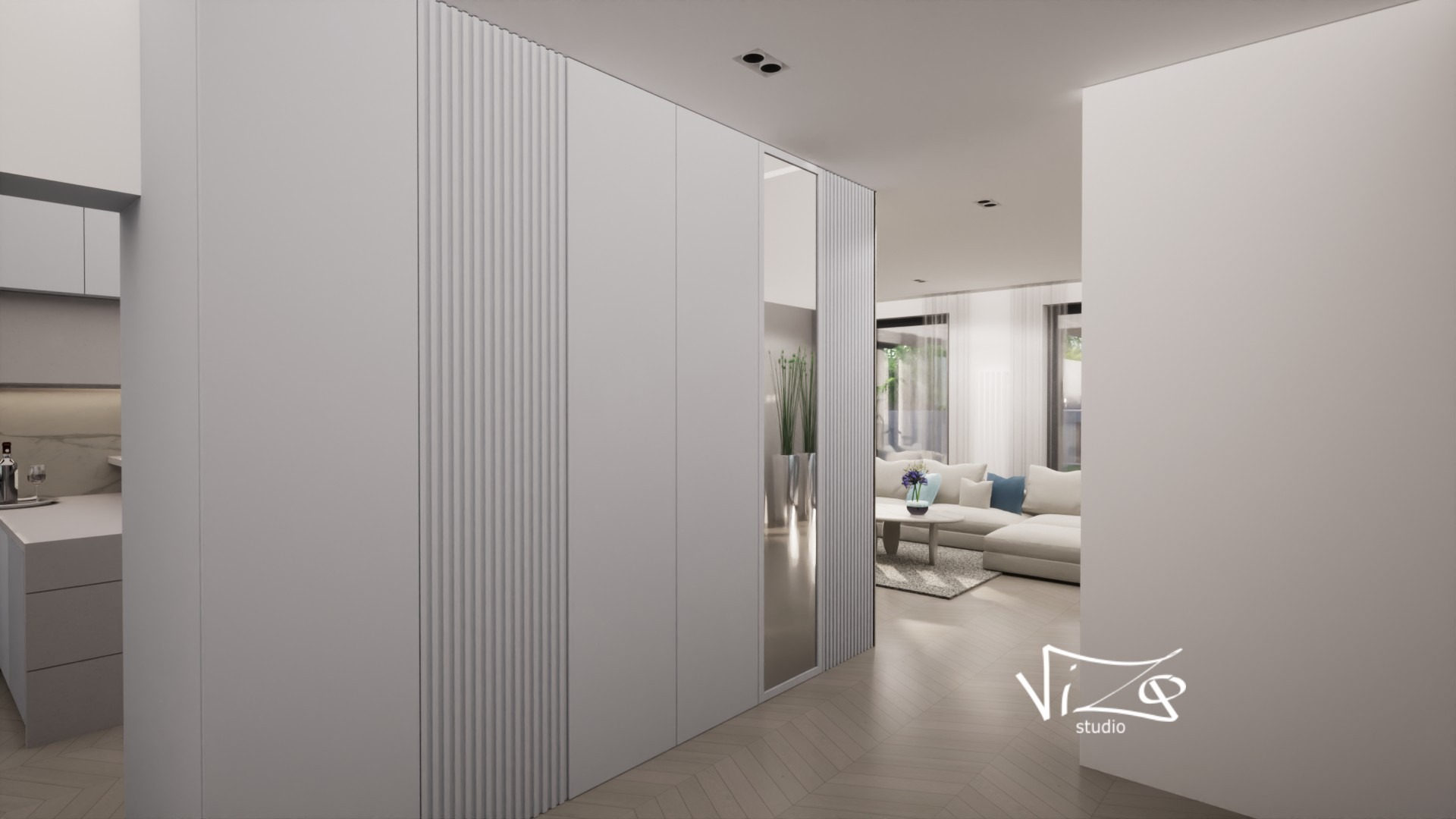 Nowoczesne wnętrze: minimalistyczny przedpokój z zabudowaną szafą z frezowanymi frontami, lustrem i widokiem na salon z sofą w odcieniach bieli i beżu oraz kuchnię z białymi frontami.