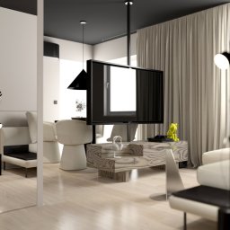KB Interior Design Karol Budziszewski - Nowoczesny salon z beżowymi zasłonami, białymi meblami i wiszącym telewizorem. Minimalistyczny design z akcentami czerni i drewna. Widok przez szklaną taflę.