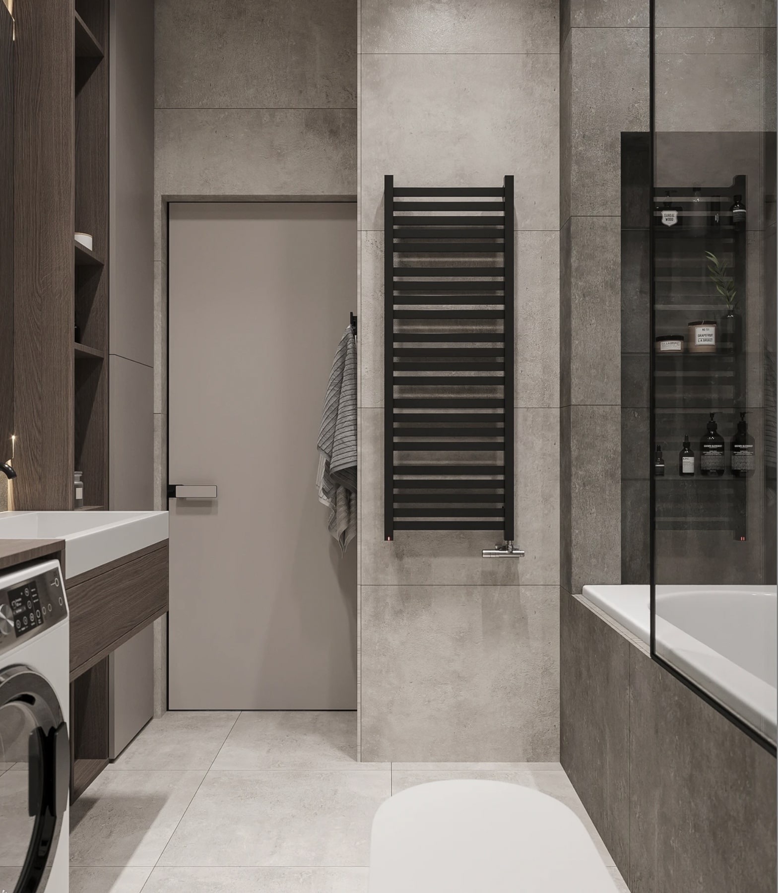 Nowoczesna łazienka w szarościach z grzejnikiem drabinkowym, wanną za szklaną ścianką i pralką obok umywalki.