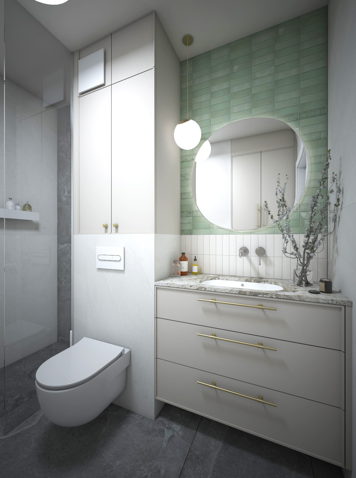 Nowoczesna łazienka z wiszącą toaletą, umywalką nablatową na szafce z trzema szufladami z złotymi uchwytami, okrągłym lustrem i zielonymi płytkami na ścianie.