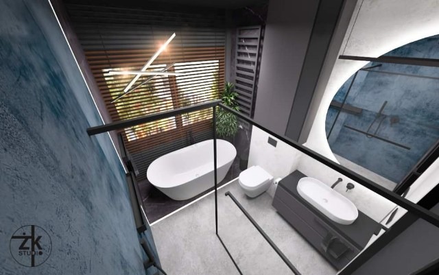 Nowoczesna łazienka z wolnostojącą wanną, szarą szafką pod umywalką i kabiną prysznicową ze szklaną ścianką, oświetlona ledowym panelem i lampą nad oknem z żaluzjami.