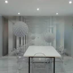 Nowoczesna jadalnia z białym stołem i przezroczystymi krzesłami na podłodze z płytek imitujących marmur, ściana z fototapetą z motywem geometrycznym.