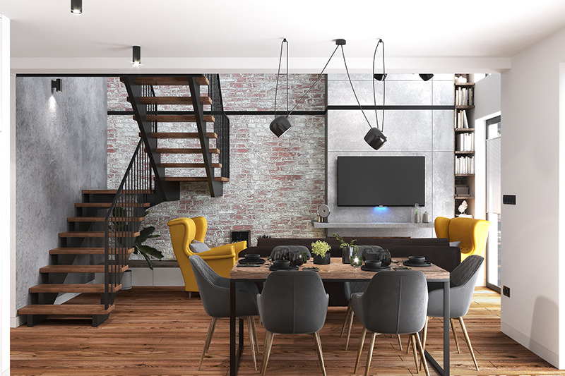 Nowoczesne wnętrze domu z drewnianymi schodami, ceglaną ścianą, żółtym fotelem typu uszak i stołem jadalnym z szarymi krzesłami.