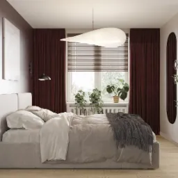 Nowoczesna sypialnia z łóżkiem kontynentalnym, burgundowymi zasłonami, okrągłym lustrem i roślinami doniczkowymi na parapecie, oświetlona lampą wiszącą w kształcie kropli.