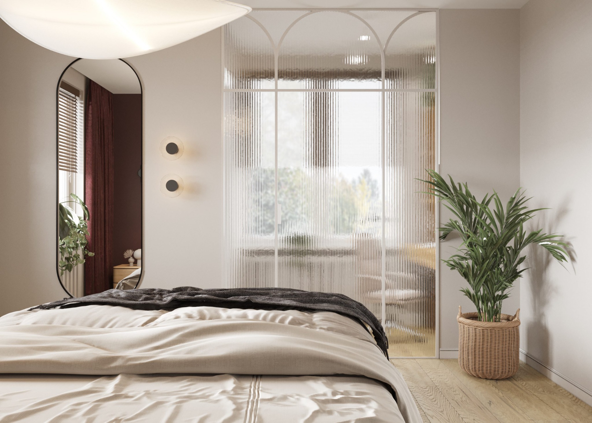 Nowoczesna sypialnia z łóżkiem w beżowej pościeli, szklaną ścianką z łukami, owalnym lustrem i dużą rośliną doniczkową w plecionym koszu.