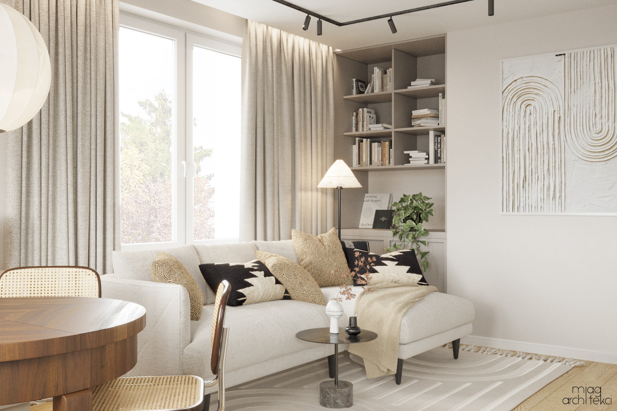 Jasny salon z narożną sofą, drewnianym stołem i krzesłami z rattanu, minimalistyczną grafiką na ścianie i regałem z książkami w tle.