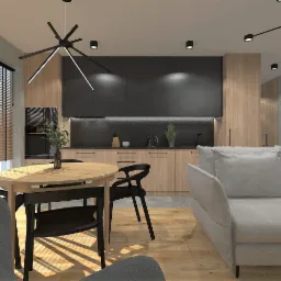 Wnętrze mieszkania z drewnianą podłogą, okrągłym stołem z czarnymi krzesłami, szarą sofą i kuchnią z drewnianymi szafkami i czarnymi górnymi szafkami, oświetlone nowoczesną lampą sufitową.
