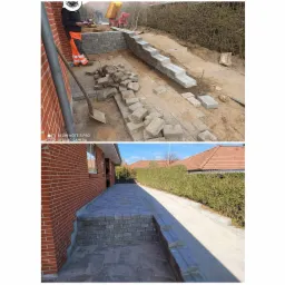 Budowa murku oporowego z betonowych bloczków: pracownik w pomarańczowych spodniach układa elementy, w tle minikoparka i ubijarka, widok na ukończoną część z kostki brukowej.