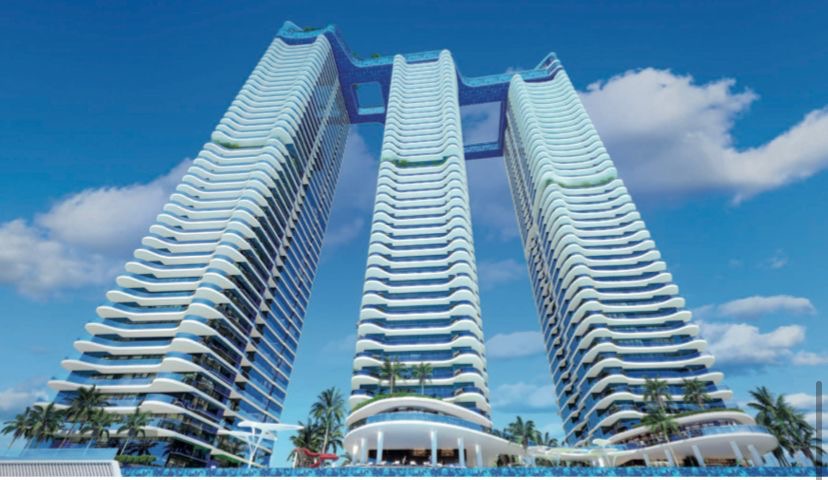 Wizualizacja trzech wieżowców z basenami na szczycie, połączonych mostami, Świdnica.