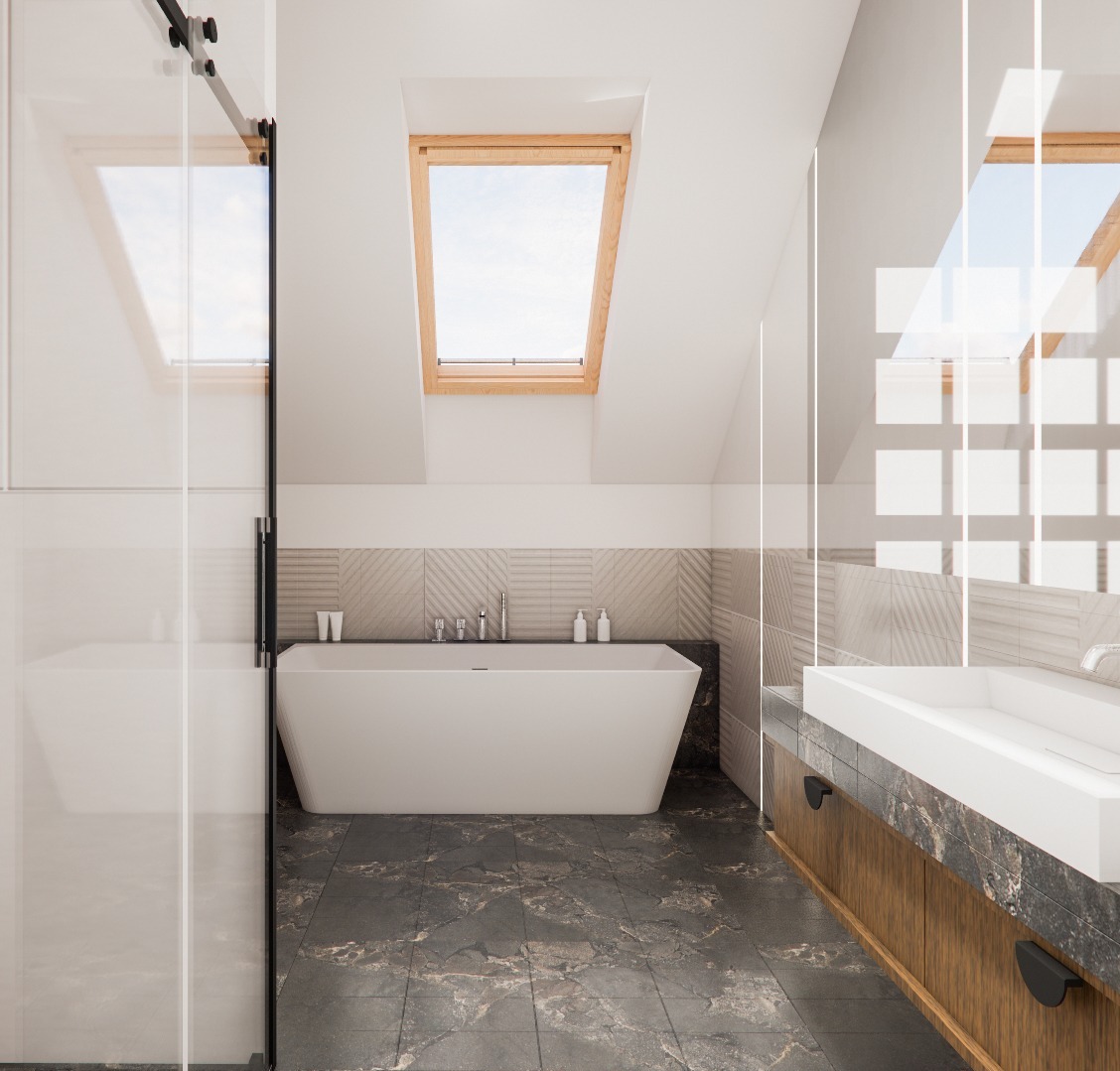 Nowoczesna łazienka na poddaszu z oknem dachowym, białą wanną wolnostojącą i umywalką nablatową. Szklana kabina prysznicowa z czarnymi okuciami. Płytki w odcieniach szarości.