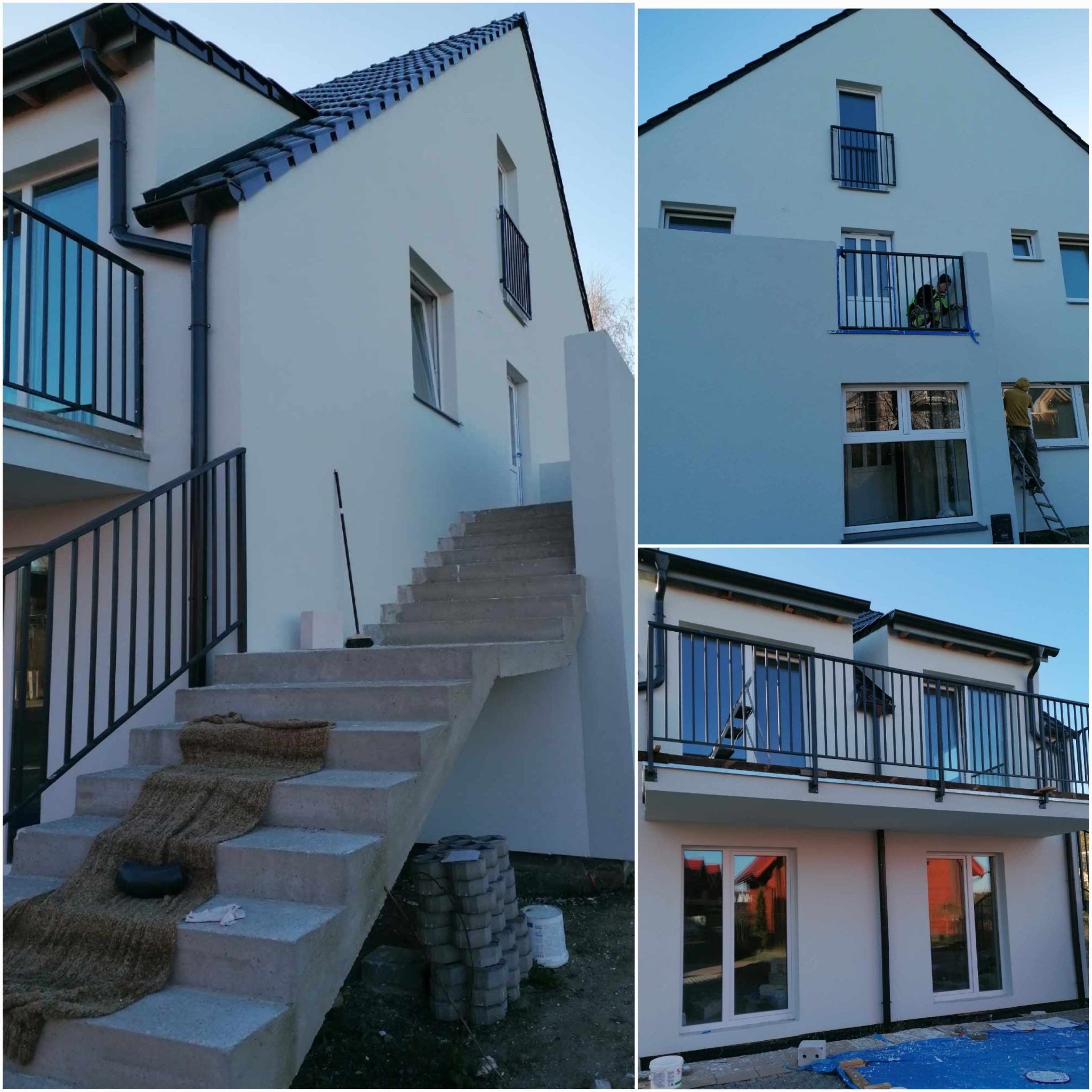 Biała elewacja domu wielorodzinnego podczas renowacji, widoczni pracownicy na drabinie malujący ścianę, na schodach zabezpieczenie, obok kostka brukowa.