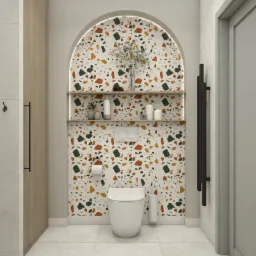 Nowoczesna łazienka z toaletą, półkami w niszy z podświetleniem LED, wykończona płytkami w stylu terrazzo z akcentami zieleni, pomarańczy i brązu, uzupełniona o drewnianą szafkę i czarny grzejnik...