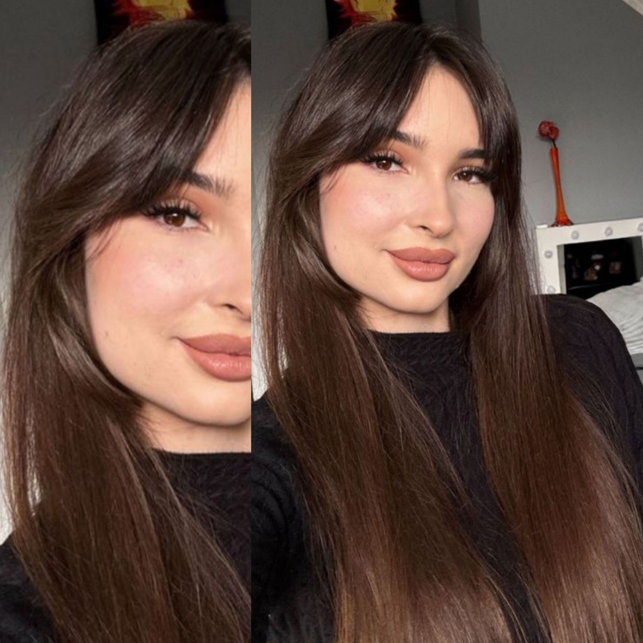 Portret kobiety z długimi, brązowymi włosami z grzywką i delikatnym makijażem w odcieniach nude, na tle szarej ściany i toaletki z lustrem.