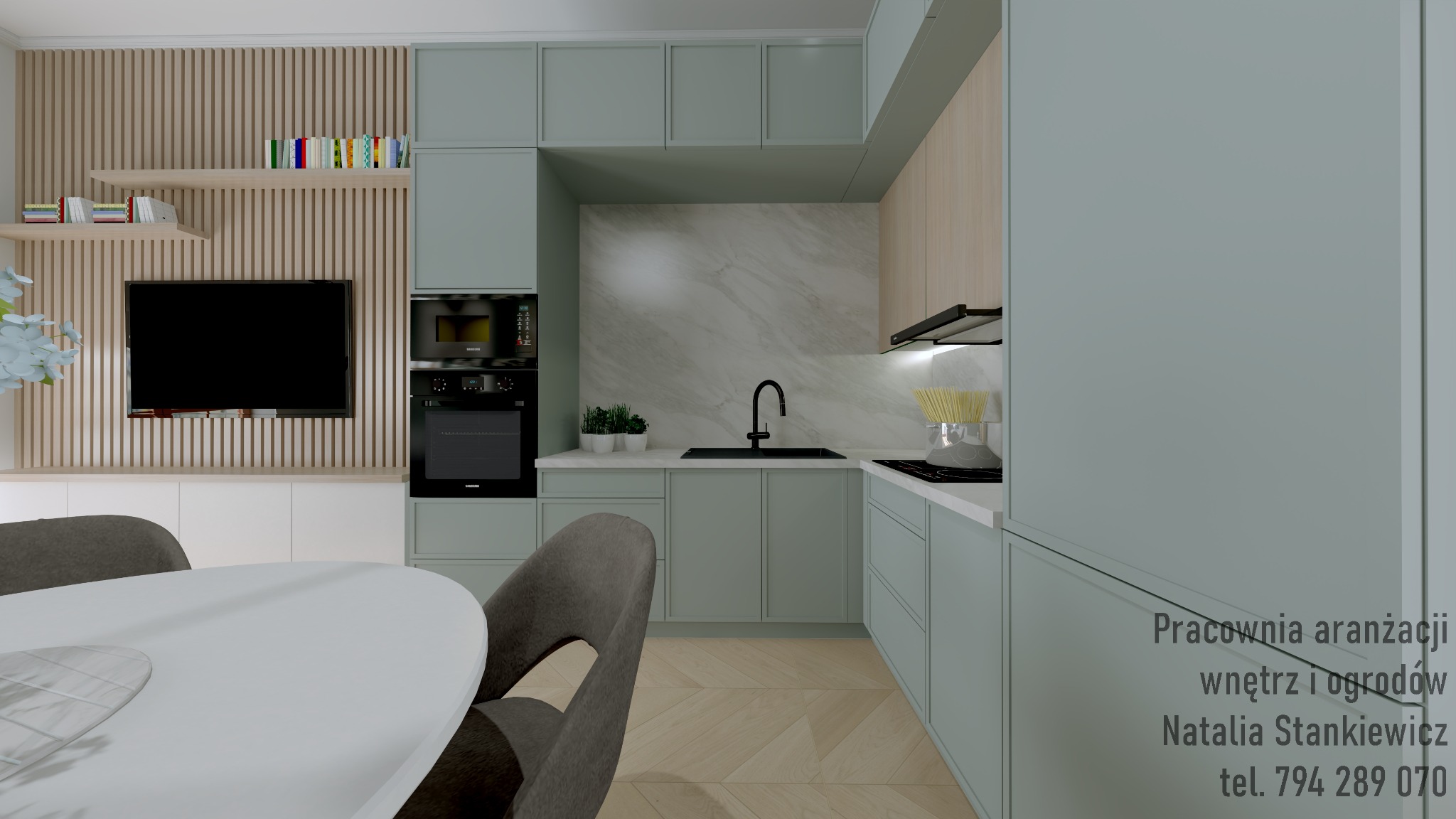 Wizualizacja nowoczesnej kuchni z pastelowymi, zielonymi szafkami, marmurowym blatem, czarną armaturą i drewnianą ścianą z telewizorem. Na pierwszym planie fragment okrągłego stołu i krzesła.