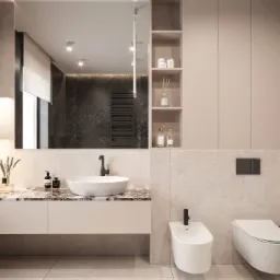 Nowoczesna łazienka z umywalką nablatową na marmurowym blacie, wiszącą toaletą i bidetem, oświetleniem punktowym i dekoracyjnymi akcesoriami.