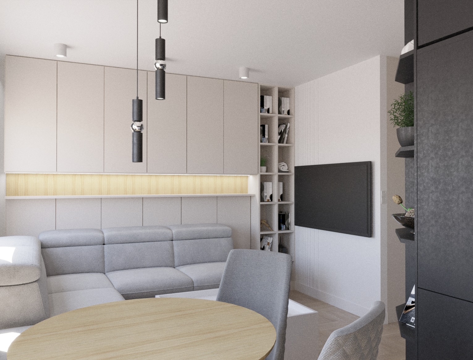 Jasne wnętrze salonu z szarą sofą modułową, okrągłym drewnianym stołem i minimalistycznym oświetleniem wiszącym, akcentowane podświetlaną wnęką i zabudową z półkami na książki.