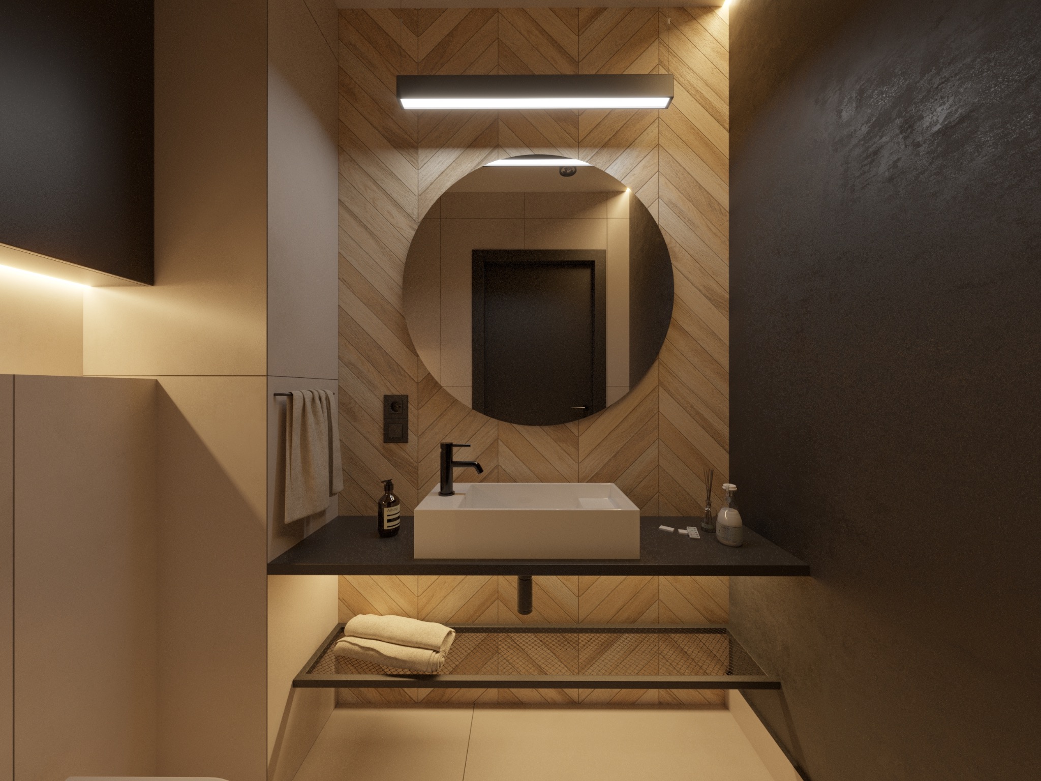 Nowoczesna łazienka z umywalką nablatową, okrągłym lustrem podświetlanym LED, drewnianą ścianą w jodełkę i ciemnoszarą ścianą z fakturą.