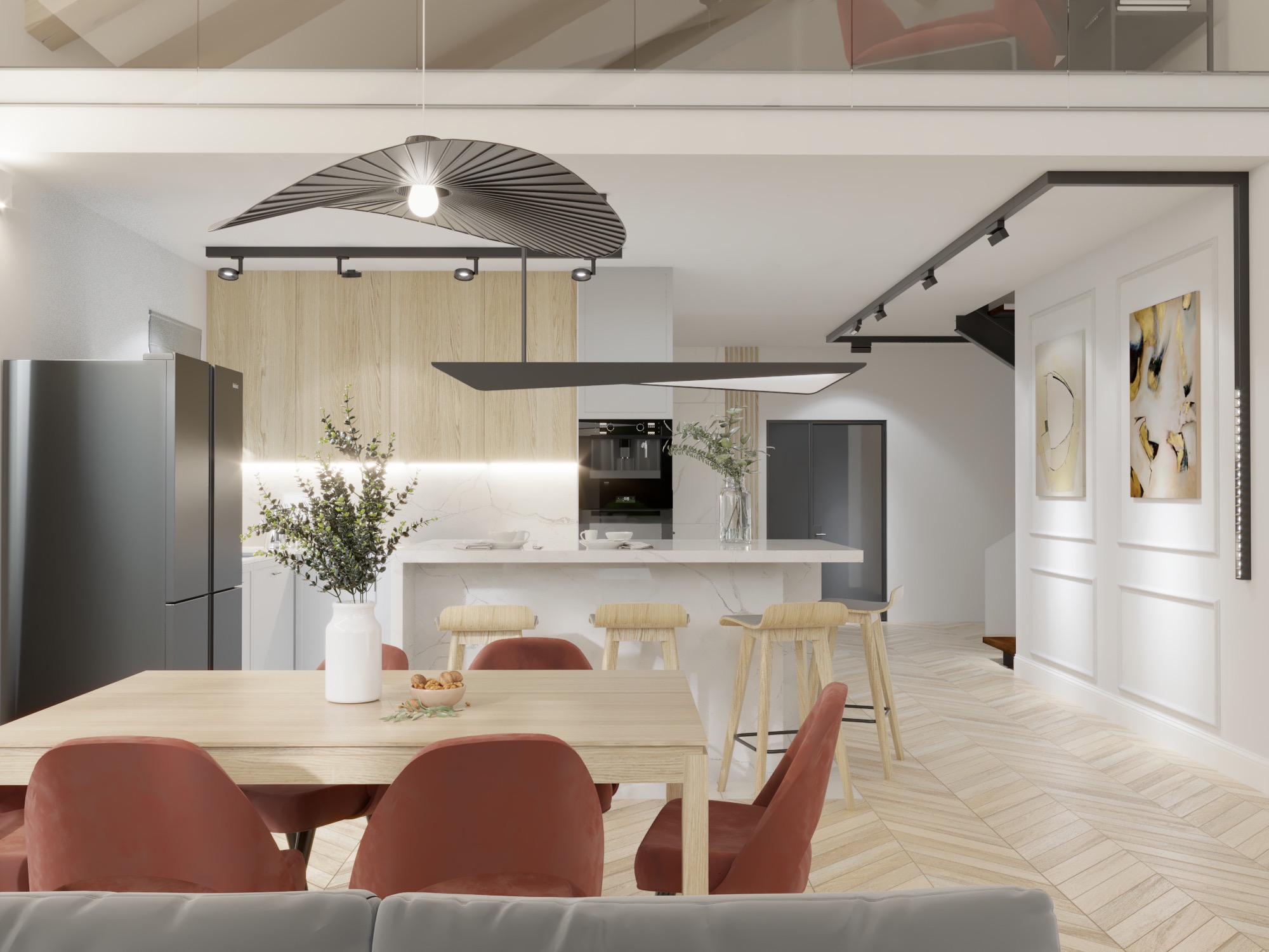 Jasna kuchnia z wyspą i jadalnią, widoczne krzesła z terakoty, designerska lampa wisząca i drewniane akcenty.