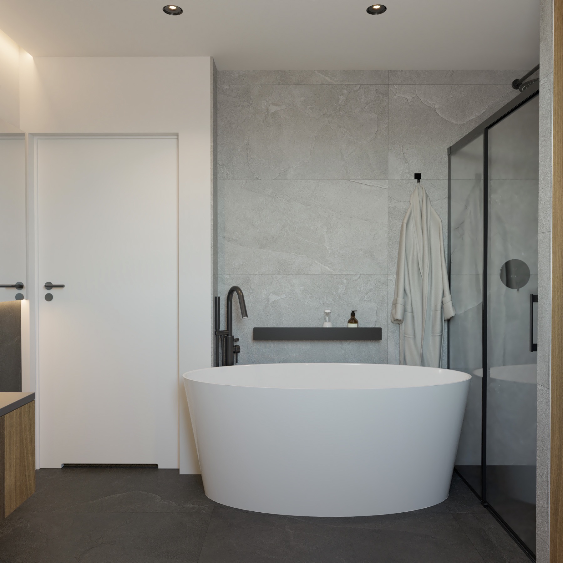 Nowoczesna łazienka z wolnostojącą białą wanną, czarną armaturą i szarymi płytkami imitującymi kamień, uzupełniona o minimalistyczną półkę z kosmetykami i szklaną kabinę prysznicową.