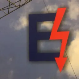 Logo firmy z niebieską literą E i czerwoną strzałką w kształcie błyskawicy na tle nieba i fragmentu konstrukcji stalowej, podpisane 'inż. Witold Matus'.