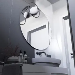 Nowoczesna łazienka w odcieniach szarości i bieli z okrągłym lustrem podświetlanym kulistymi lampami, minimalistyczna umywalka nablatowa i dekoracyjny bukiet w wazonie.